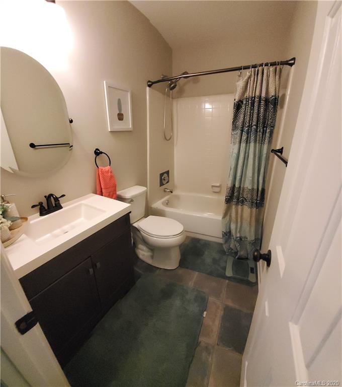 20700 Willow Pond Road Cornelius, NC 28031 - Photo 36 of 47 a bathroom with a double vanity sink toilet and shower