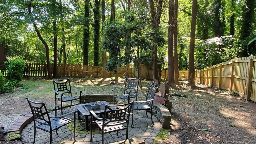 20700 Willow Pond Road Cornelius, NC 28031 - Photo 40 of 47 a view of an chairs and table in the backyard
