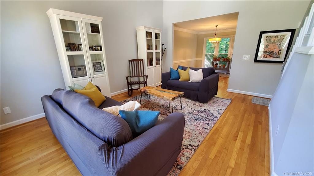 20700 Willow Pond Road Cornelius, NC 28031 - Photo 5 of 47 a living room with furniture and a rug