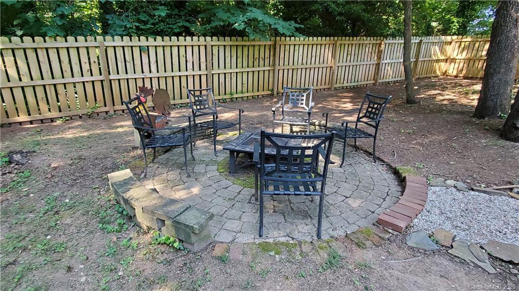 20700 Willow Pond Road Cornelius, NC 28031 - Photo 41 of 47 a view of a chairs and table in the back yard