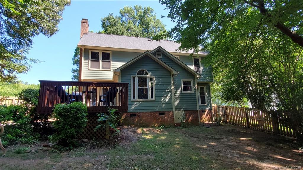 20700 Willow Pond Road Cornelius, NC 28031 - Photo 44 of 47 a front view of a house with a yard and garage