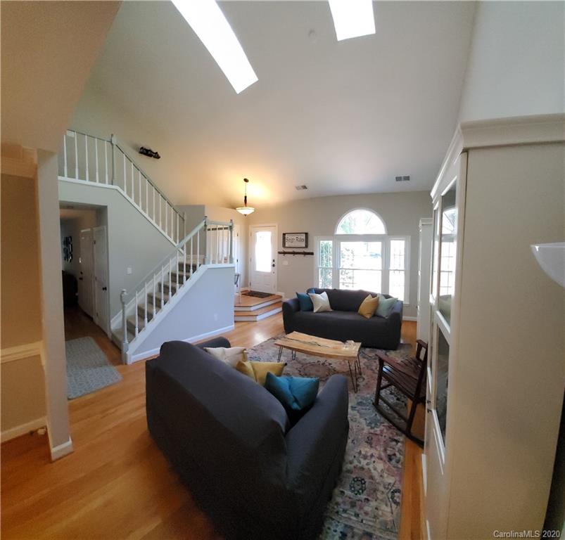 20700 Willow Pond Road Cornelius, NC 28031 - Photo 6 of 47 a living room with furniture and a large window