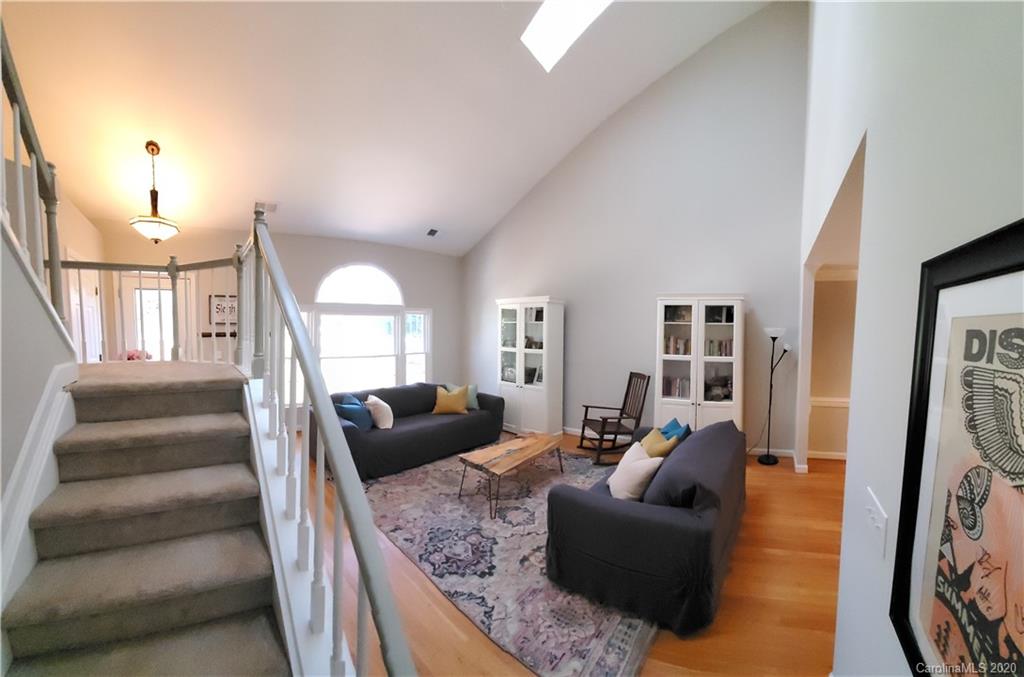 20700 Willow Pond Road Cornelius, NC 28031 - Photo 7 of 47 a living room with furniture and a couch