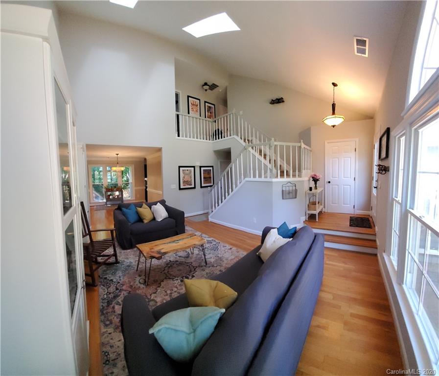 20700 Willow Pond Road Cornelius, NC 28031 - Photo 8 of 47 a living room with furniture and a wooden floor