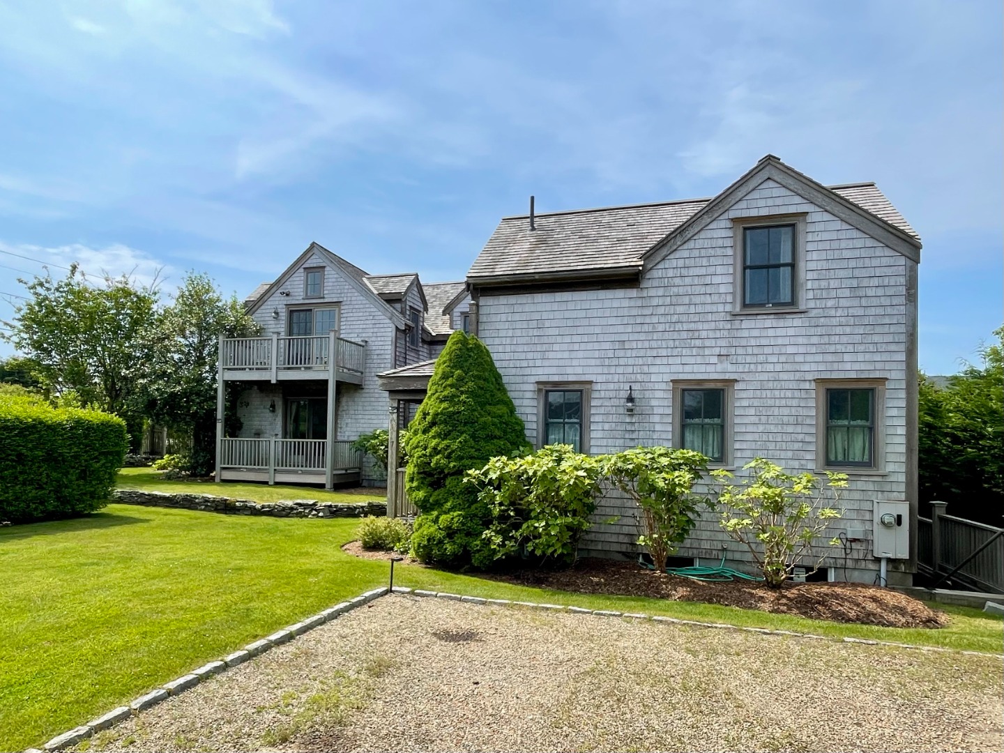 155 Surfside Road Nantucket, MA 02554 - Photo 37 of 60 a front view of a house with a yard