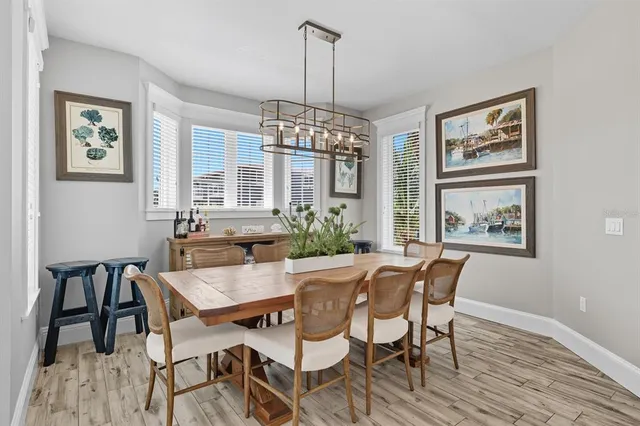 a view of a balcony with furniture and wooden floor