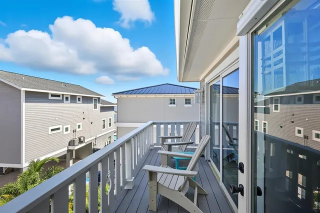 a view of a roof deck with patio