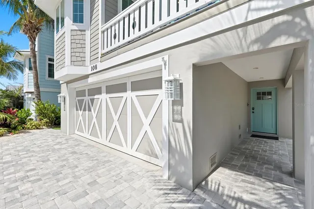 a kitchen with kitchen island granite countertop a table chairs stainless steel appliances and cabinets