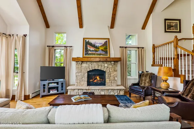 a bathroom with a granite countertop shower sink vanity and mirror