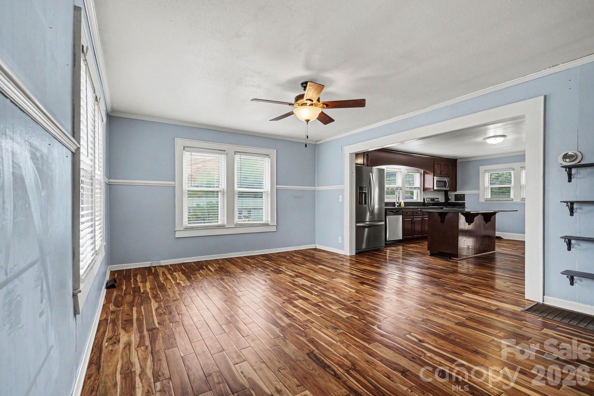 24359 Ridgecrest Road Locust, NC 28097 - Photo 6 of 26 wooden floor in an empty room with a window