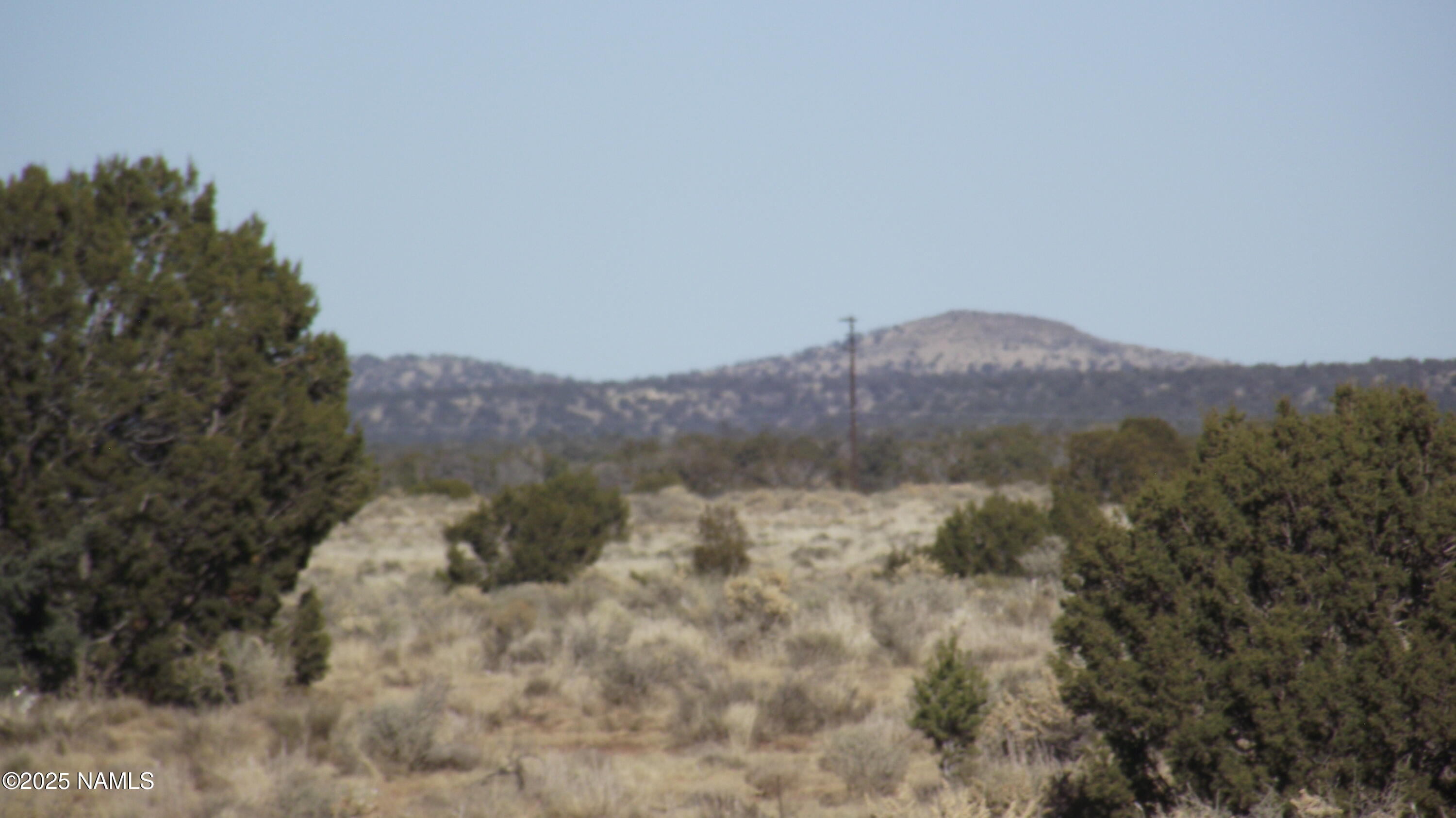 a view of a town with mountains in the background