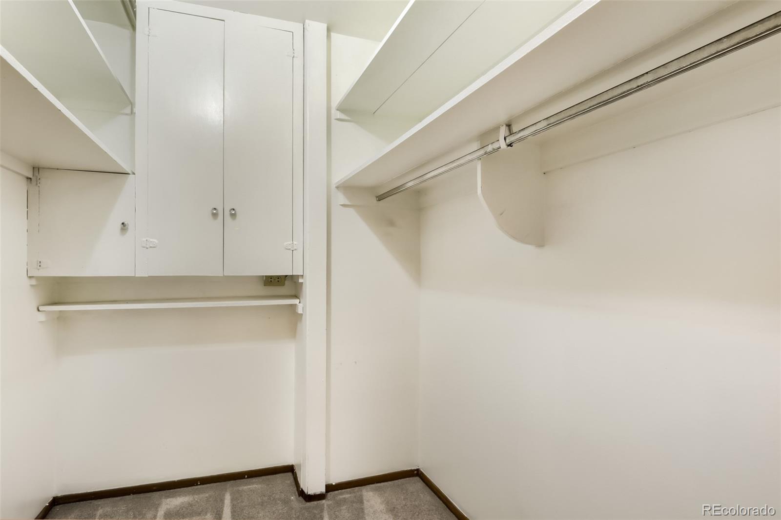 625 South Clinton Street, Unit 7B Denver, CO 80247 - Photo 13 of 22 a view of walk in closet with clothes