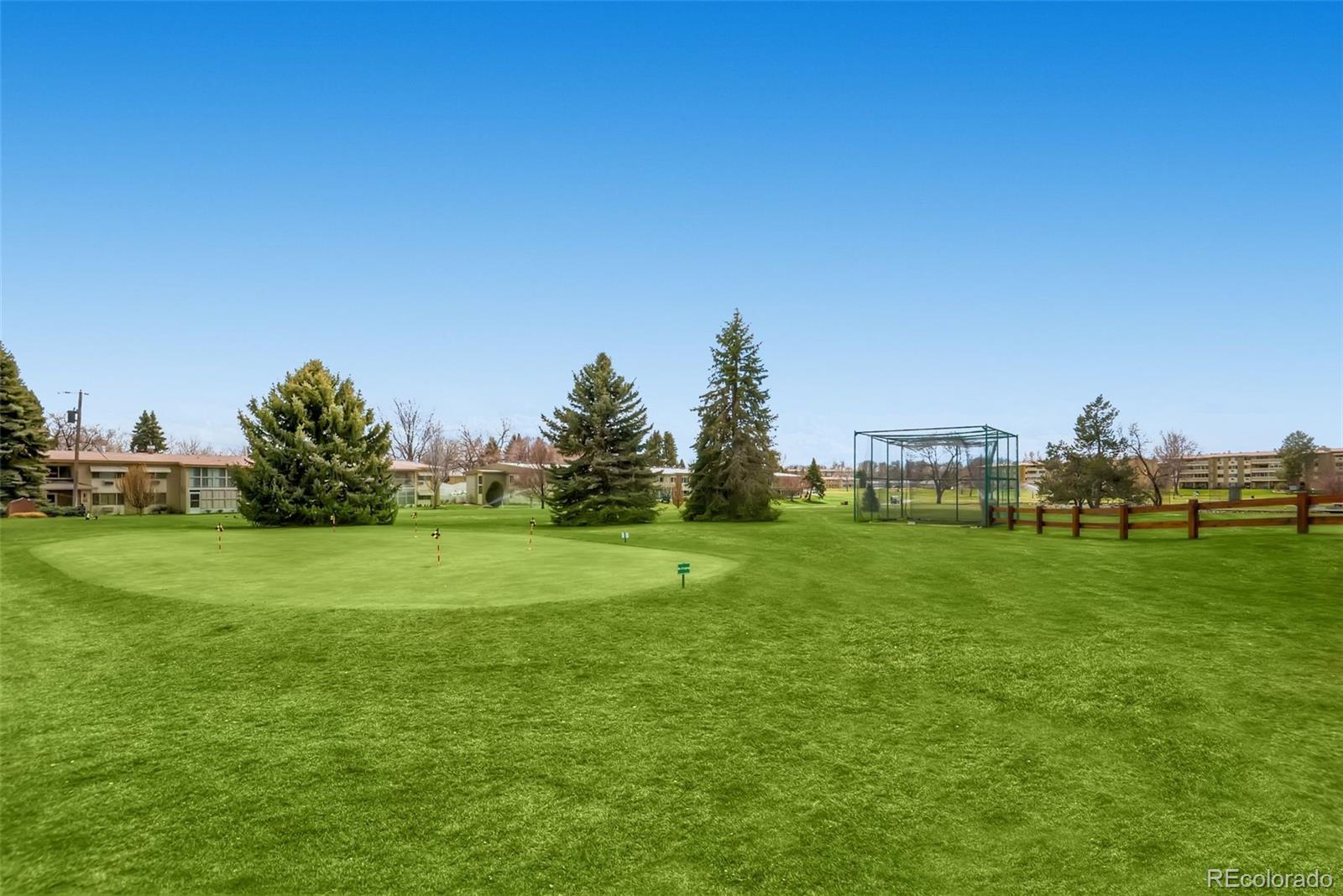 625 South Clinton Street, Unit 7B Denver, CO 80247 - Photo 17 of 22 a view of a golf course with a lake