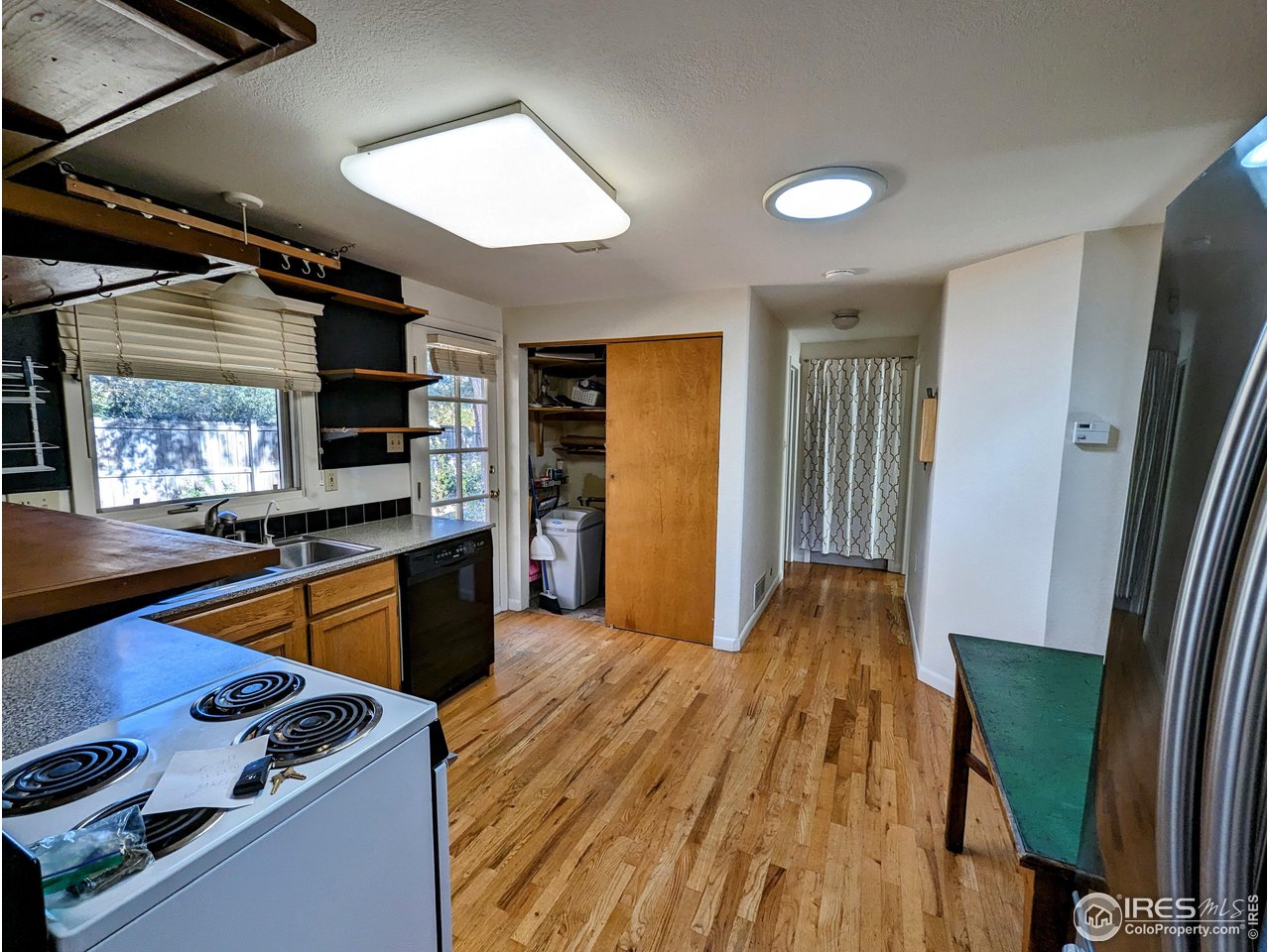1951 Vista Drive Boulder, CO 80304 - Photo 23 of 35 a kitchen with stainless steel appliances granite countertop a refrigerator and a stove top oven