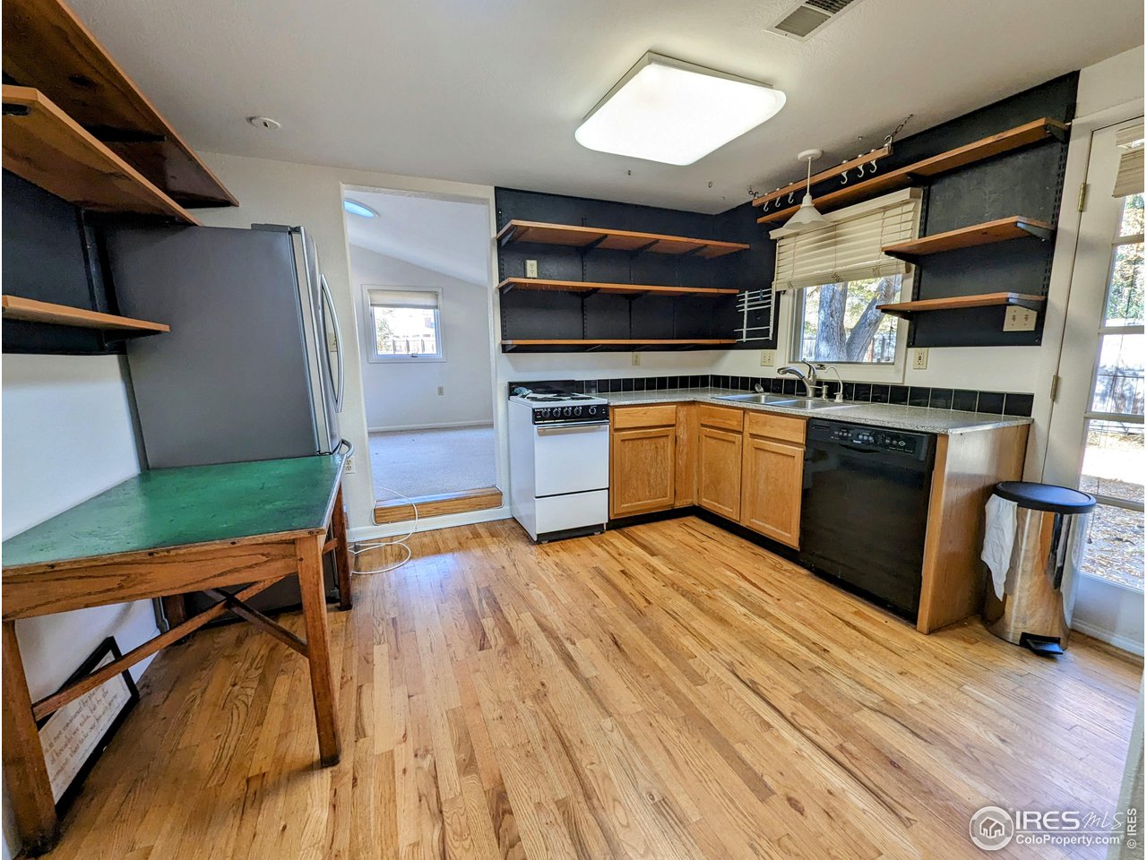 1951 Vista Drive Boulder, CO 80304 - Photo 24 of 35 a kitchen with stainless steel appliances granite countertop a stove and a refrigerator