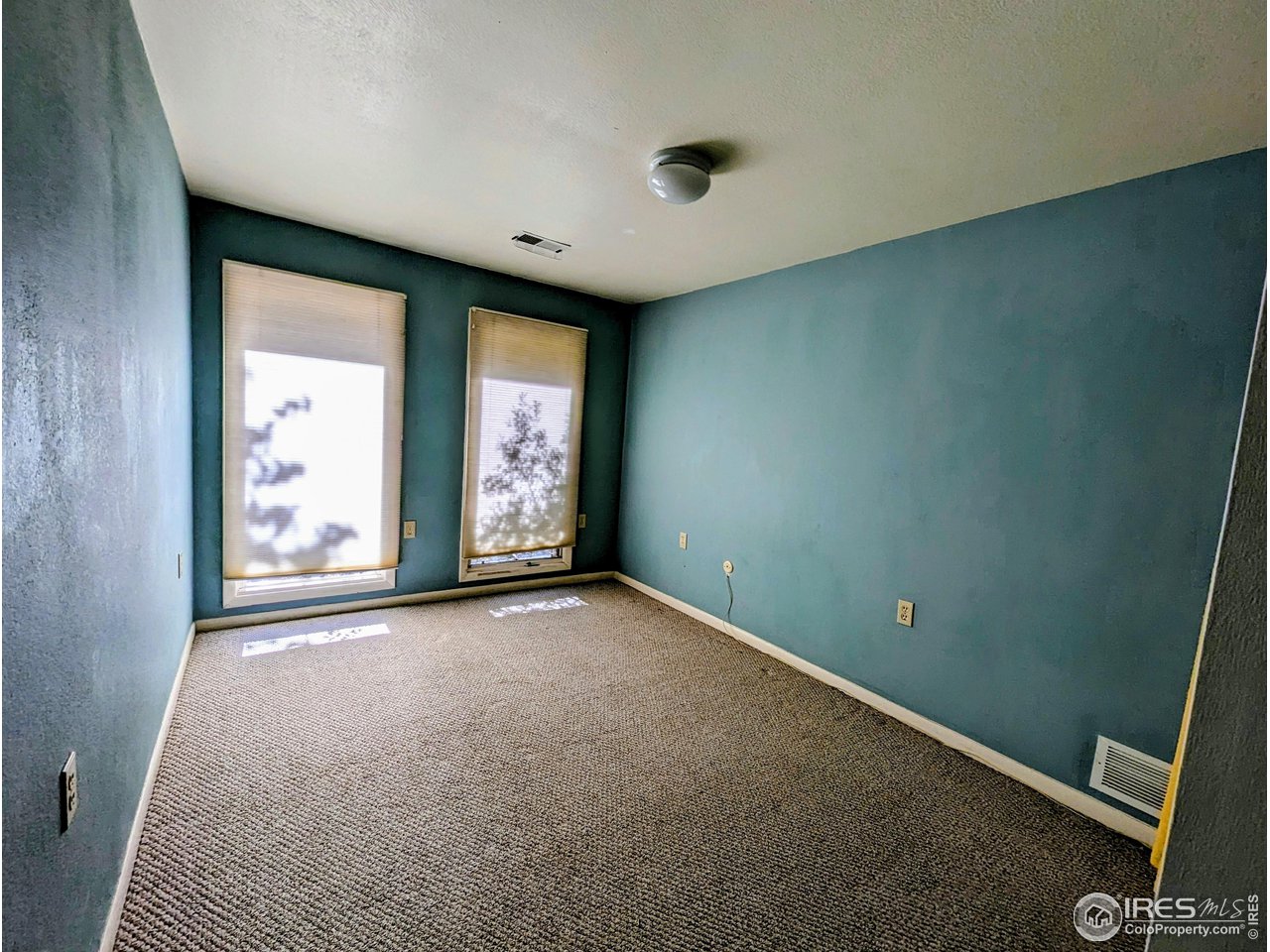 1951 Vista Drive Boulder, CO 80304 - Photo 27 of 35 an empty room with windows and closet