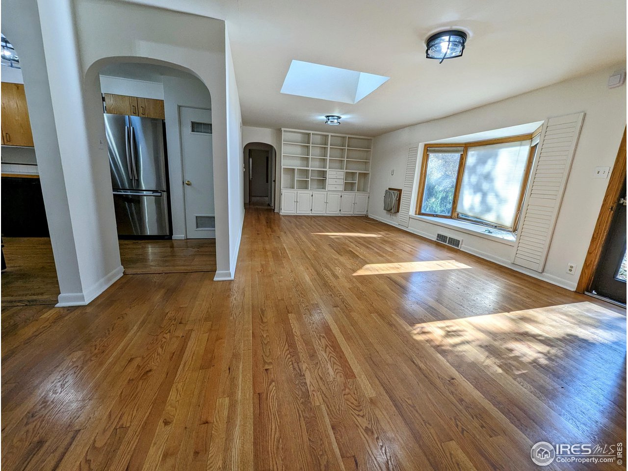1951 Vista Drive Boulder, CO 80304 - Photo 3 of 35 a view of an empty room with wooden floor and a window