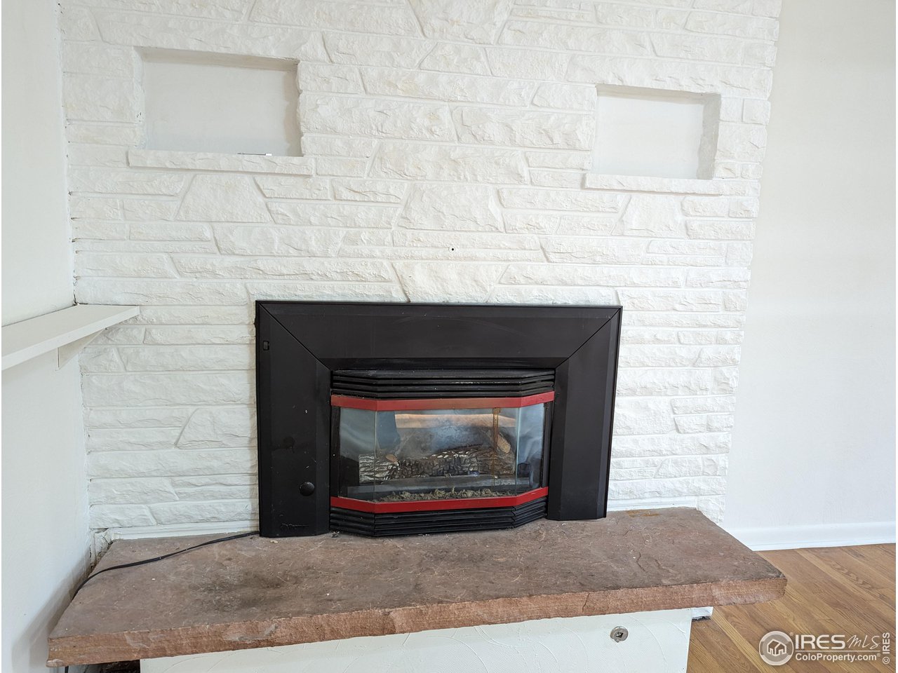 1951 Vista Drive Boulder, CO 80304 - Photo 7 of 35 a fireplace with a clock