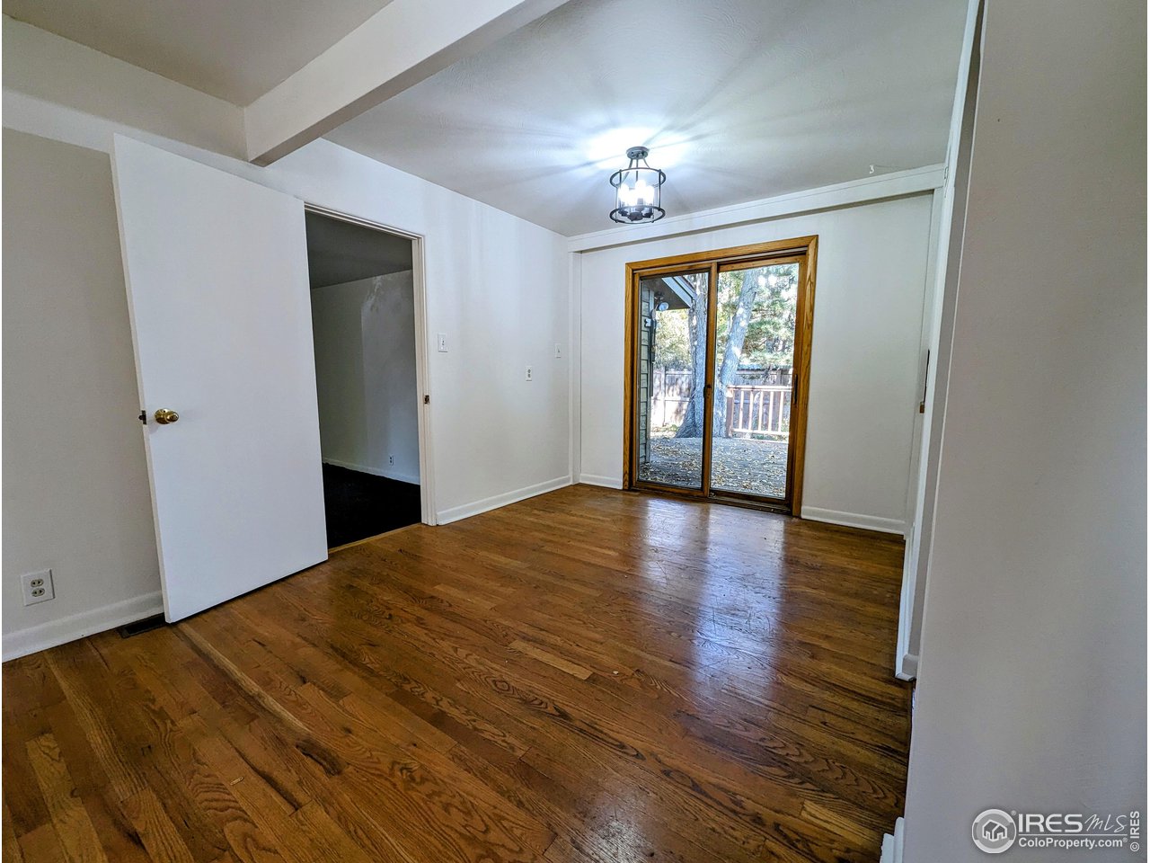 1951 Vista Drive Boulder, CO 80304 - Photo 9 of 35 a view of empty room with wooden floor and fan