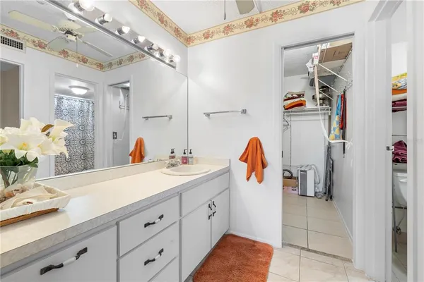 a bathroom with a sink double vanity and mirror