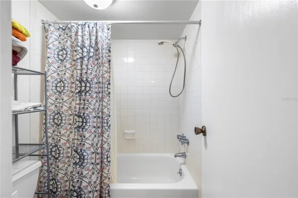 a bathroom with a shower curtain