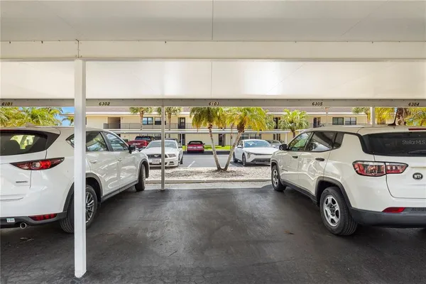 a view of a car garage with furniture