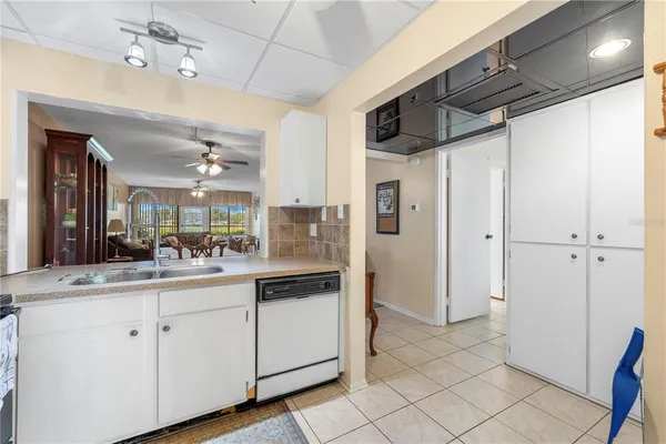 a kitchen with a sink and refrigerator