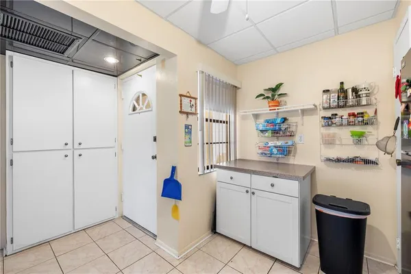 a very nice looking open kitchen with a sink cabinets and appliances