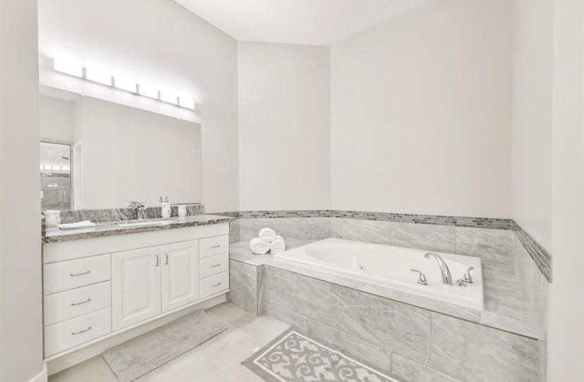 8002 Harbor Point Drive Houston, TX 77071 - Photo 12 of 25 a bathroom with a granite countertop sink and a mirror