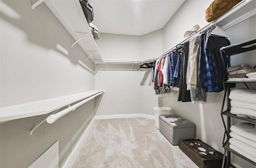 8002 Harbor Point Drive Houston, TX 77071 - Photo 15 of 25 a view of walk in closet with clothes and shoes