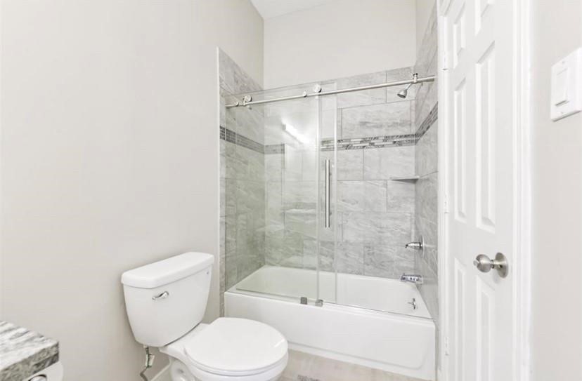 8002 Harbor Point Drive Houston, TX 77071 - Photo 18 of 25 a bathroom with a toilet and a bathtub