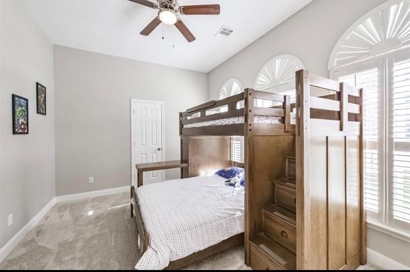 8002 Harbor Point Drive Houston, TX 77071 - Photo 19 of 25 a bedroom with a bed window and a walk in closet
