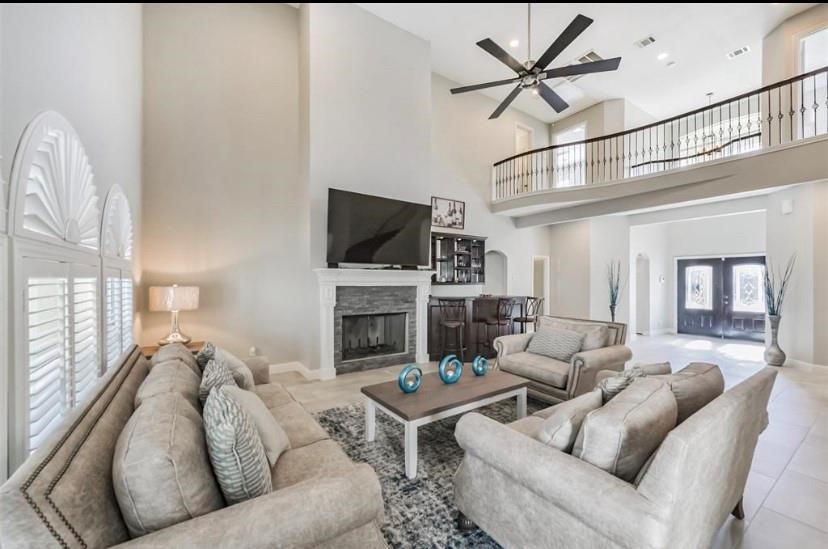 8002 Harbor Point Drive Houston, TX 77071 - Photo 6 of 25 a living room with furniture a flat screen tv and a fireplace
