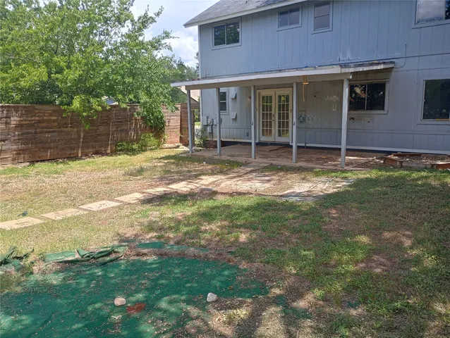 a backyard of a house with seating space