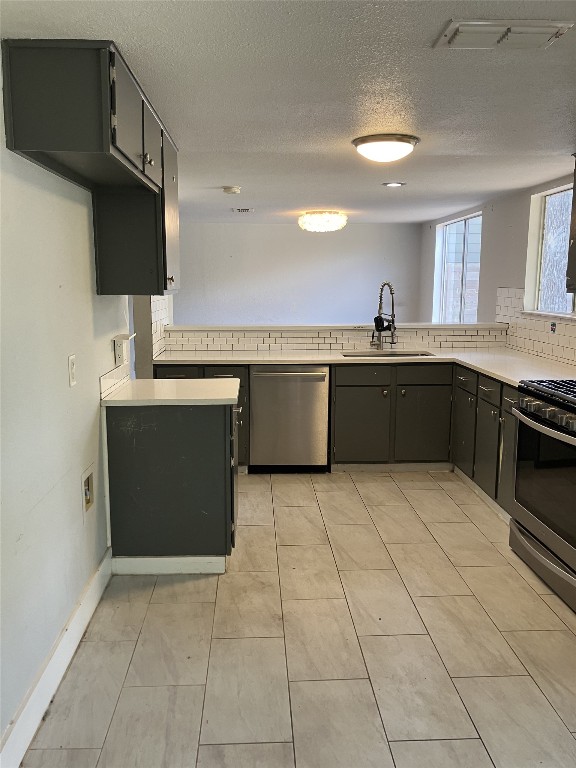 7700 Copperas Drive Austin, TX 78749 - Photo 10 of 14 a kitchen with a sink cabinets and appliances