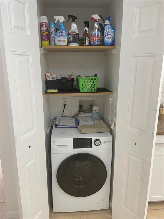 1 Key Capri, Unit 104W Treasure Island, FL 33706 - Photo 17 of 49 a utility room with dryer and washer