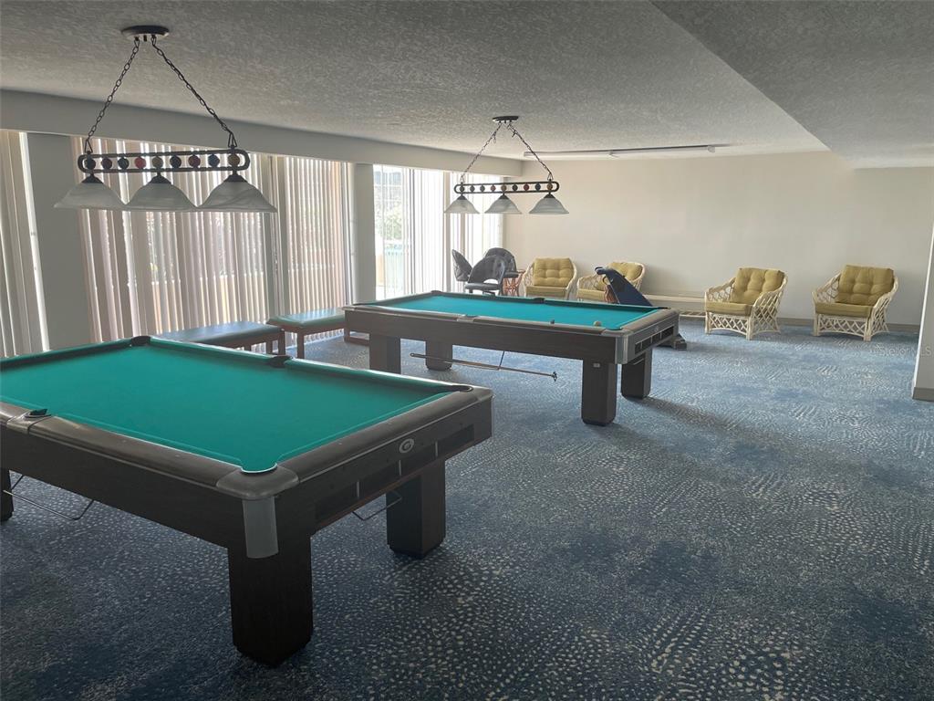 1 Key Capri, Unit 104W Treasure Island, FL 33706 - Photo 31 of 49 a room with pool table and windows