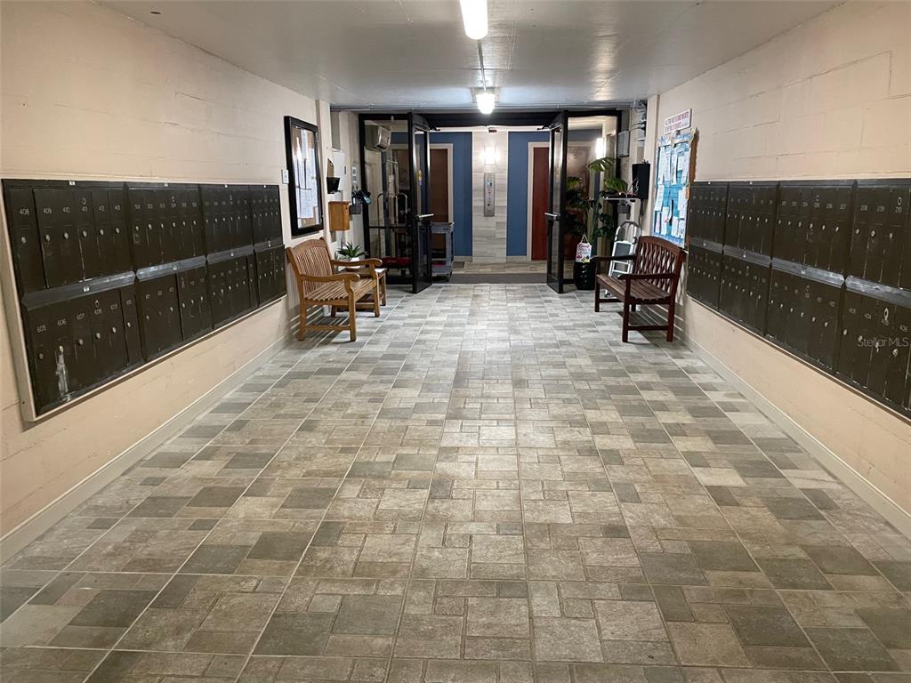 1 Key Capri, Unit 104W Treasure Island, FL 33706 - Photo 33 of 49 a view of a lobby with gym equipment