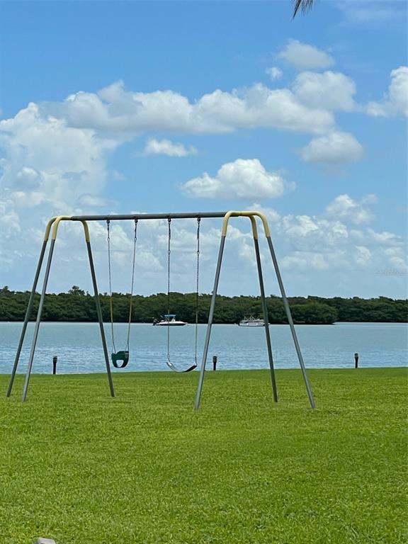 1 Key Capri, Unit 104W Treasure Island, FL 33706 - Photo 37 of 49 a view of a garden