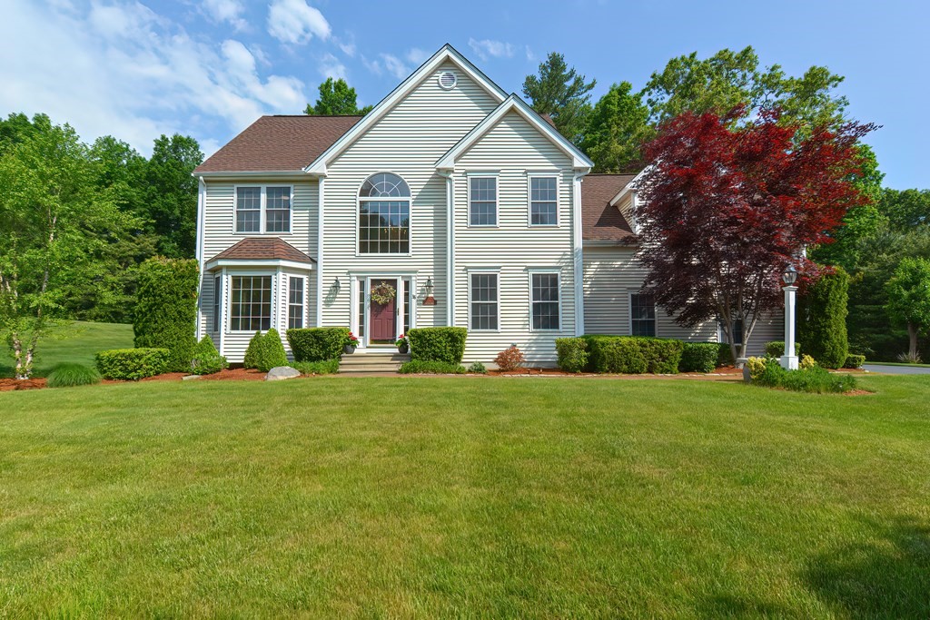 38 Pennock Road Ashland, MA 01721 - Photo 1 of 40 a front view of a house with a yard