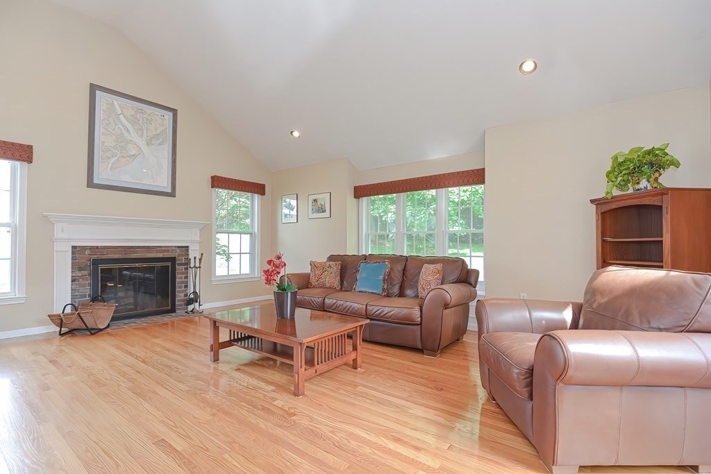 38 Pennock Road Ashland, MA 01721 - Photo 18 of 40 a living room with furniture and a fireplace