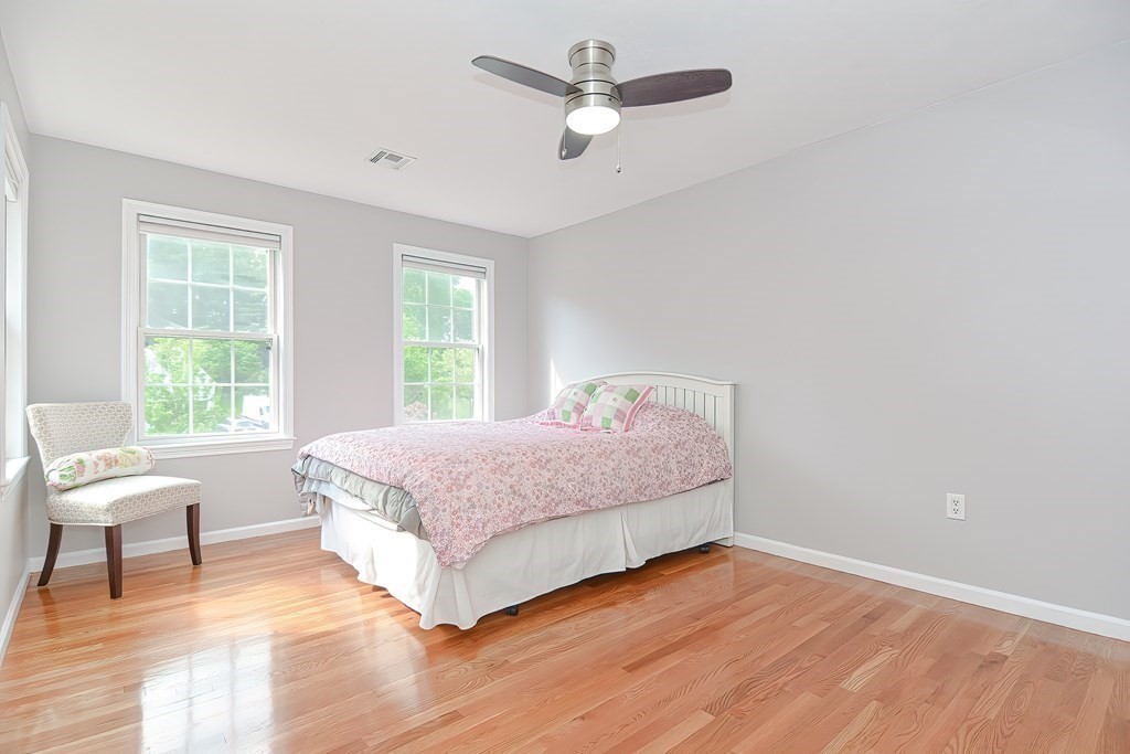 38 Pennock Road Ashland, MA 01721 - Photo 24 of 40 a spacious bedroom with a bed and a chair