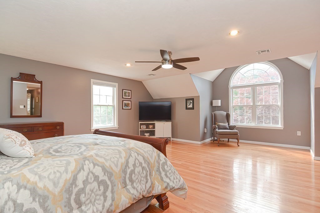 38 Pennock Road Ashland, MA 01721 - Photo 29 of 40 a bedroom with a large bed and a large window