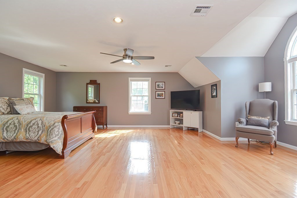 38 Pennock Road Ashland, MA 01721 - Photo 30 of 40 a spacious bedroom with a bed and a chair