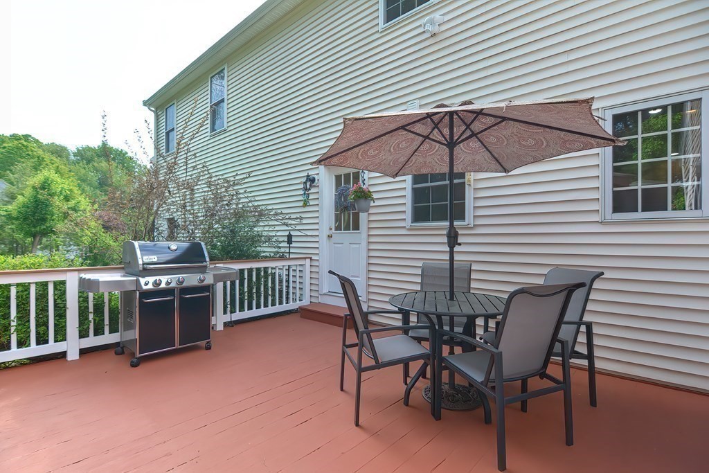 38 Pennock Road Ashland, MA 01721 - Photo 35 of 40 a view of a chair and table in the back yard