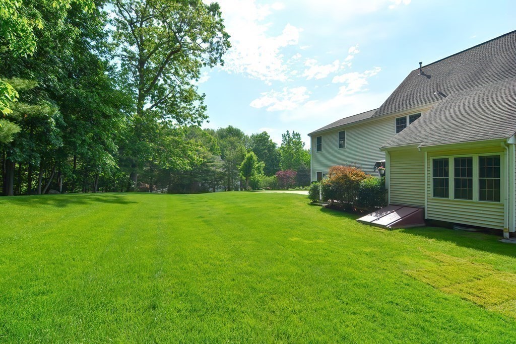38 Pennock Road Ashland, MA 01721 - Photo 37 of 40 a view of a house with a backyard