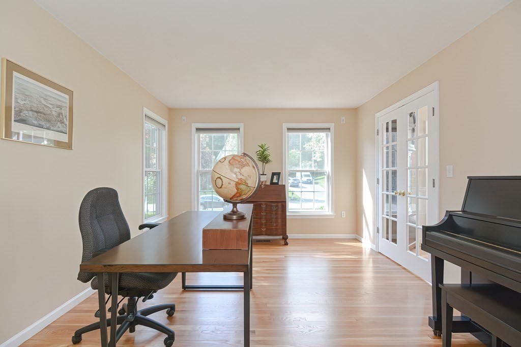 38 Pennock Road Ashland, MA 01721 - Photo 9 of 40 a living room with furniture a table and wooden floor