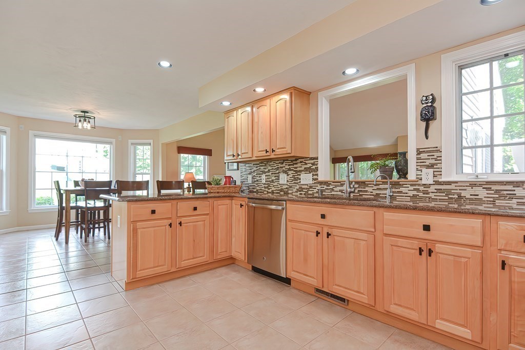 38 Pennock Road Ashland, MA 01721 - Photo 10 of 40 a large kitchen with granite countertop a large window and white cabinets