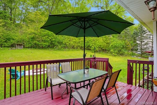 29 Hickory Hill Road Newburgh, NY 12550 - Photo 46 of 47 a view of a deck in the backyard with a chair