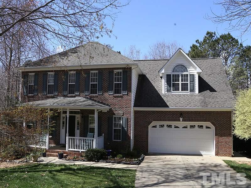 2008 Waterbrook Court Raleigh, NC 27603 - Photo 1 of 13 a front view of a house with garden